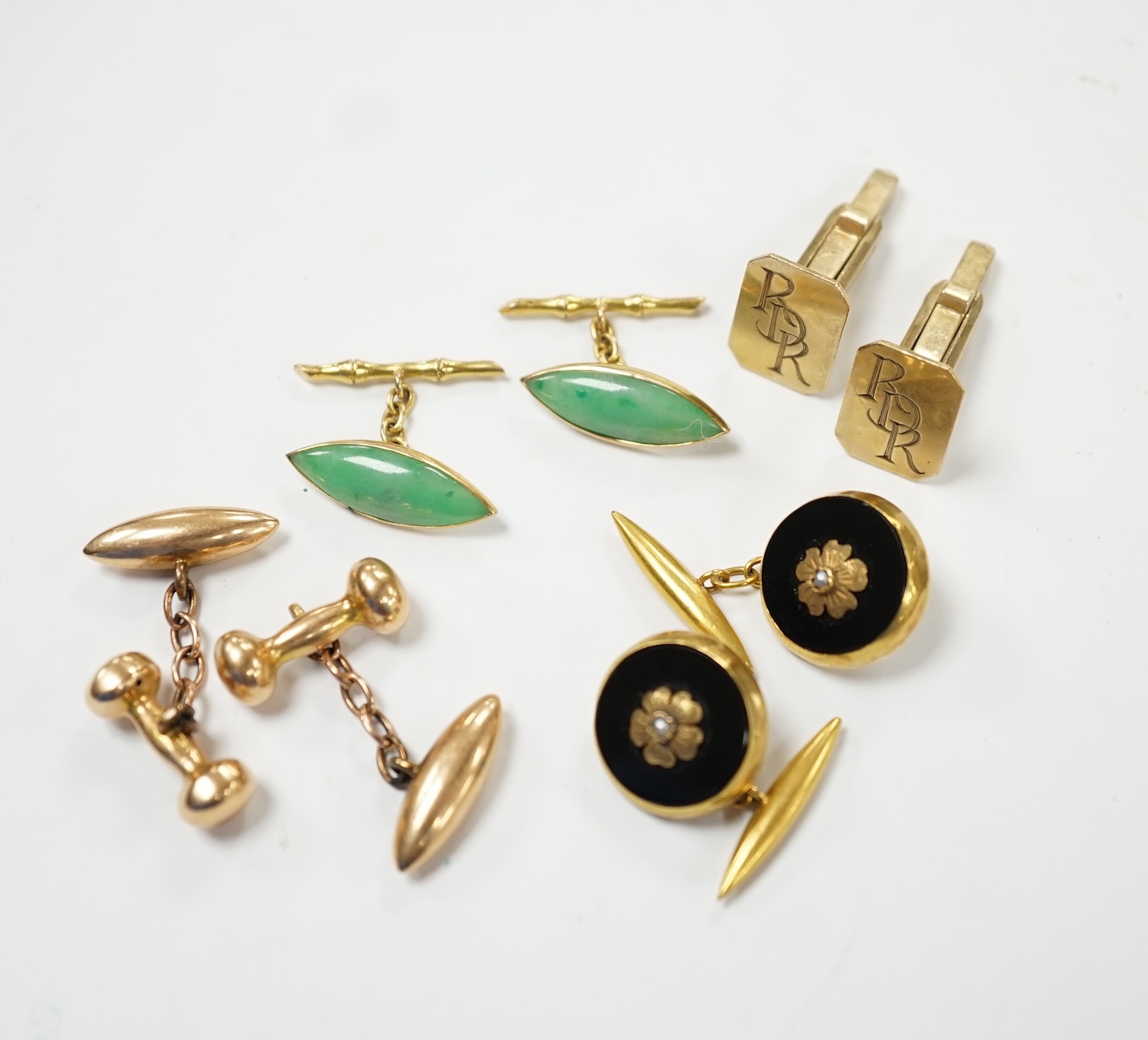 A pair of Edwardian 15ct gold torpedo shaped cufflinks, 9,6 grams and three other pairs of cufflinks including Chinese jade and monogrammed 9ct gold. Fair to good condition.